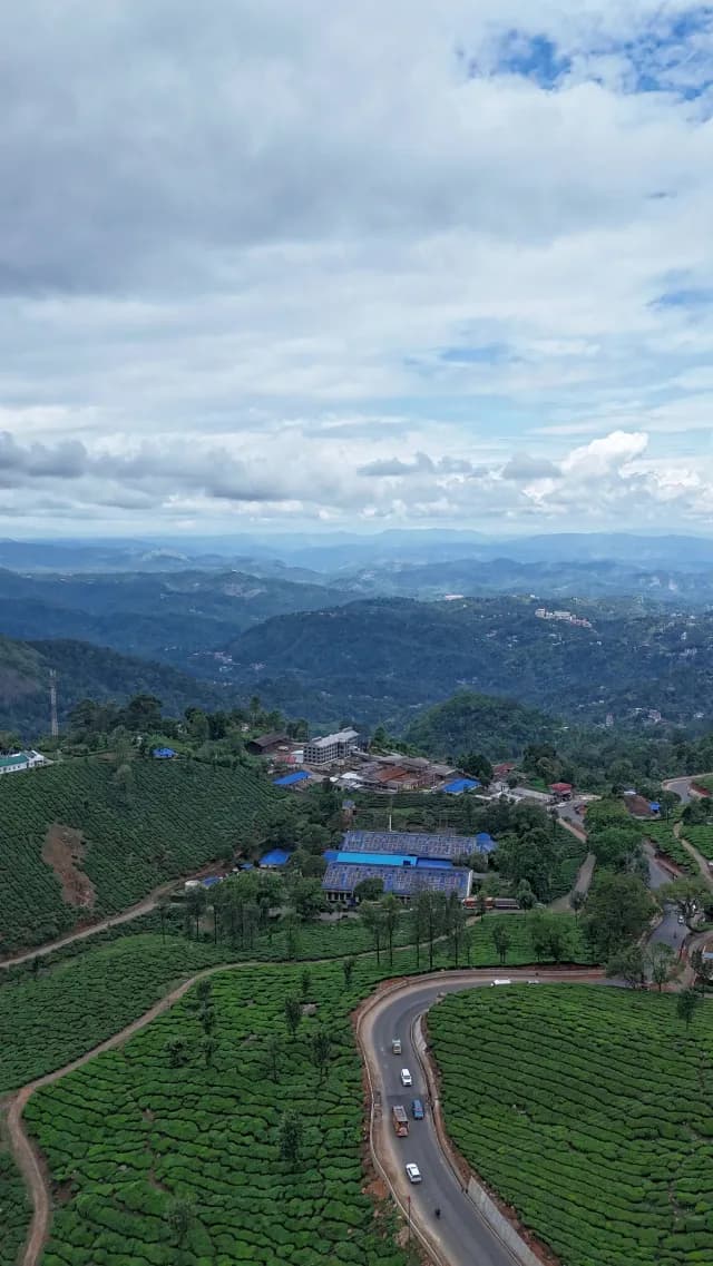Aerial View of Lush Tea Plantations and Winding Roads in Munnar