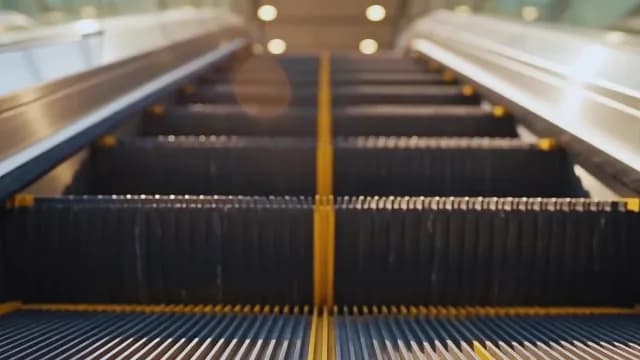 Low Angle View of Moving Escalator Stairs in Modern Station