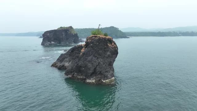 Aerial View of Volcanic Island Formations in Tropical Sea at Cabo De Rama Beach, Goa