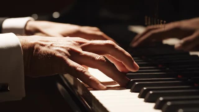 Professional Pianist Hands Playing Grand Piano Close-up