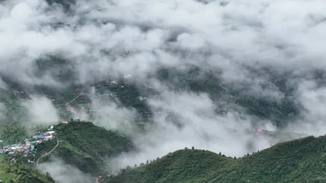 Aerial View of Foggy Mountain Village in Lush Valley, Mussoorie