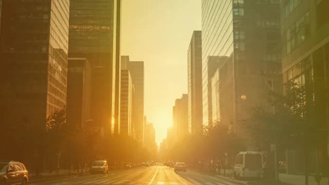 Golden Hour Sunset Over Modern City Skyscrapers and Urban Traffic