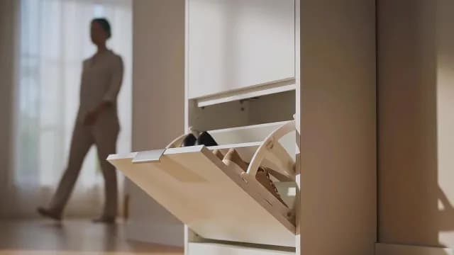 Modern White Tilt-Out Shoe Cabinet Organizer in Minimalist Home Hallway