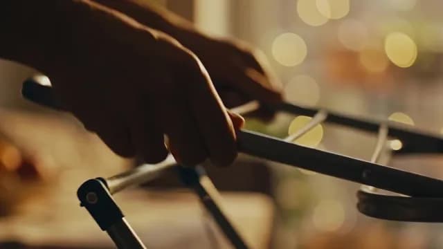 Close-up of Senior Hands Using Walker in Cozy Home Setting