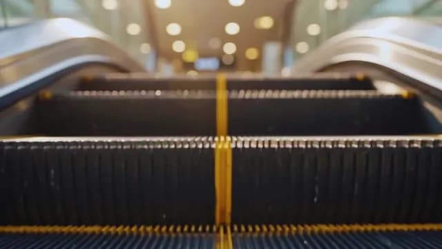 Close Up of Moving Escalator Steps in Modern Public Space