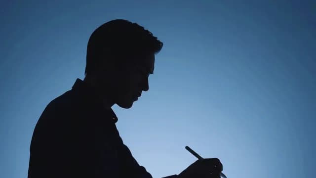 Silhouette of Professional Artist Using Digital Stylus and Tablet