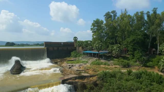 Scenic Waterfall at Rajdari Devdari Dam with Lush Greenery