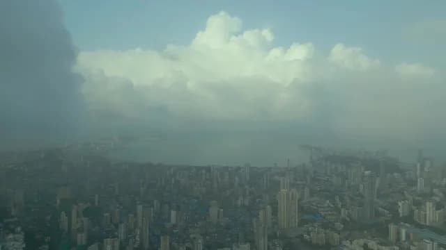 Aerial View of Mumbai Cityscape Under Moody Storm Clouds