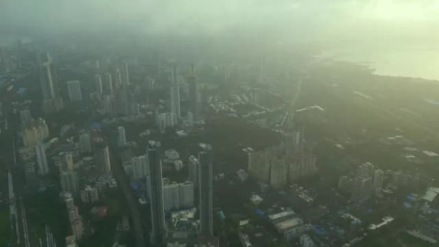 Aerial View of Foggy Mumbai Skyline and Modern Skyscrapers at Dawn