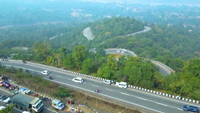 Aerial View of Winding Mountain Highway Through Lush Green Patratu Valley