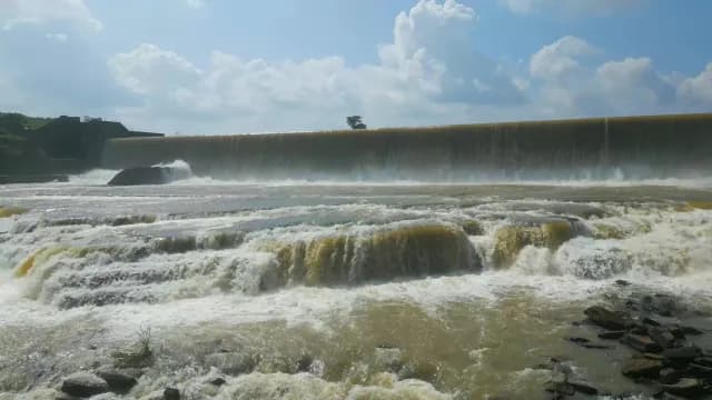 Water Cascading Over a Large Rajdari Devdari Dam Spillway and Rocky Rapids