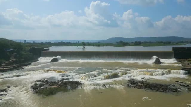 Scenic Wide Waterfall Cascading Over Rural River Rajdari Devdari Dam