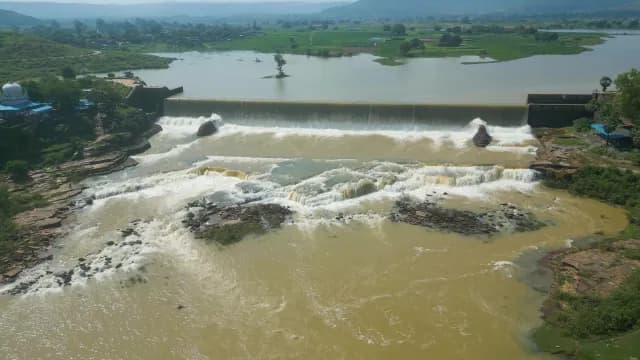 Aerial View of River Rajdari Devdari Dam with Water Cascading Over Spillway