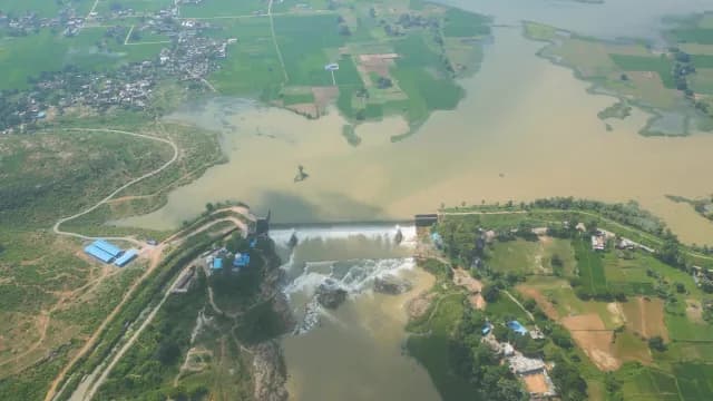Aerial View of River Dam Spillway and Green Farmland Rajdari Devdari Dam