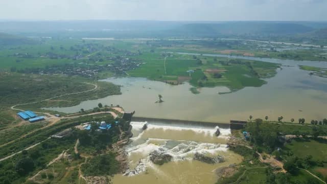 Aerial View of Water Cascading Over Rural Rajdari Devdari Dam into Waterfall