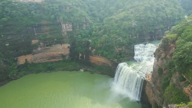 Aerial View of Majestic Purwa Falls and Steep Rocky Cliffs, Rajdari Devdari Dam