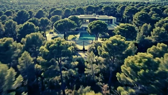 Aerial View of Modern Luxury Villa in Dense Pine Forest