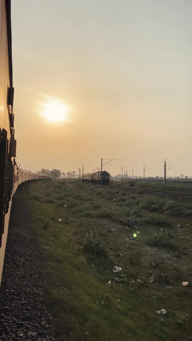 Sunset View of Passing Passenger Trains in Rural India