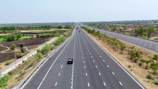 Aerial View of Multi-Lane Modern National Delhi-Mumbai Expressway NE4 Through Rural Landscape