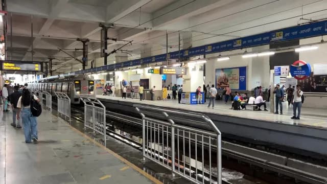 Delhi Metro Train Arriving at Vishwavidyalaya Station Platform