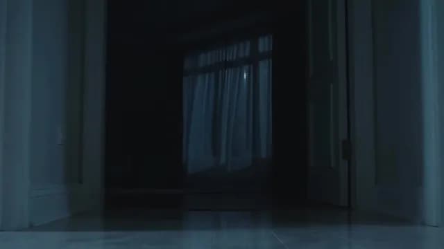 Dark Bedroom at Night Seen Through Open Doorway