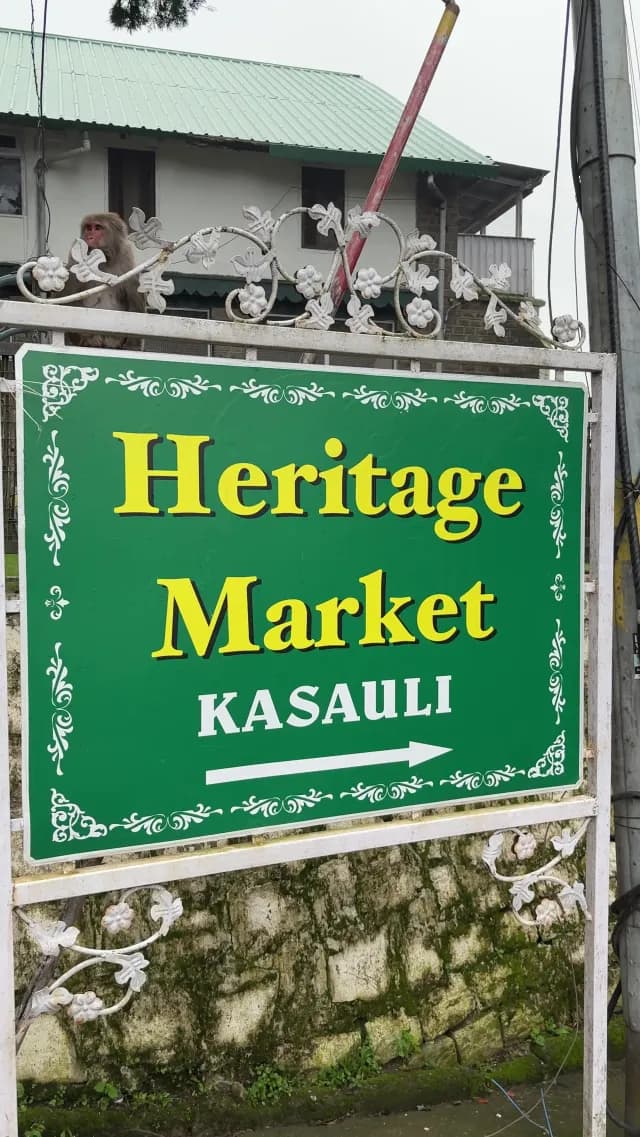 Heritage Market Sign in Kasauli with Monkey Perched Above