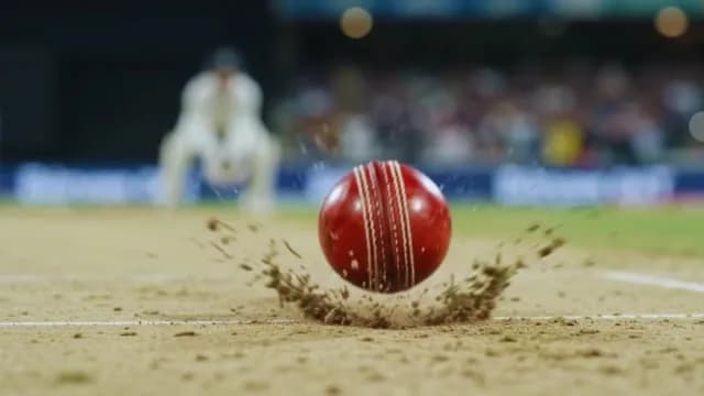 Action Close-Up of Red Cricket Ball Bouncing on Pitch and Batsman Hitting the Ball