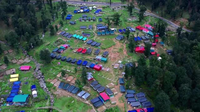 Aerial View of Colorful Mountain Campsite in Lush Forest Chopta, Uttrakhand
