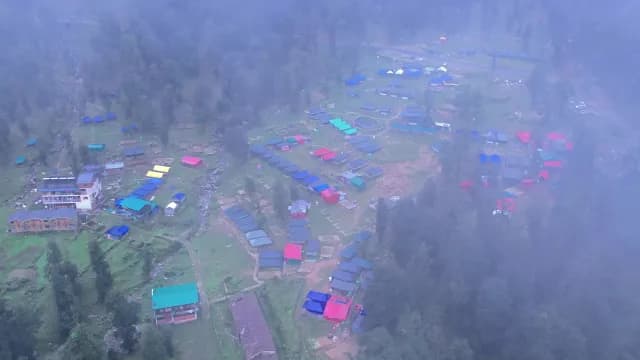 Aerial View of Colorful Mountain Base Camp in Misty Forest Chopta, Uttrakhand