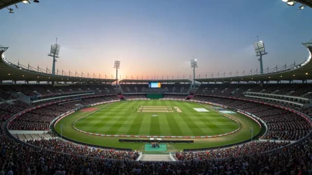 Panoramic View of a Packed Cricket Stadium at Sunset
