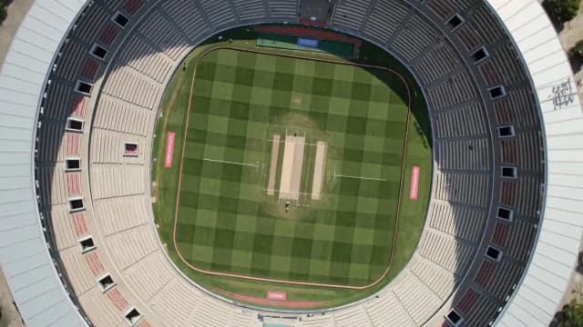 Aerial Top-Down View of a Professional Cricket Stadium and Field