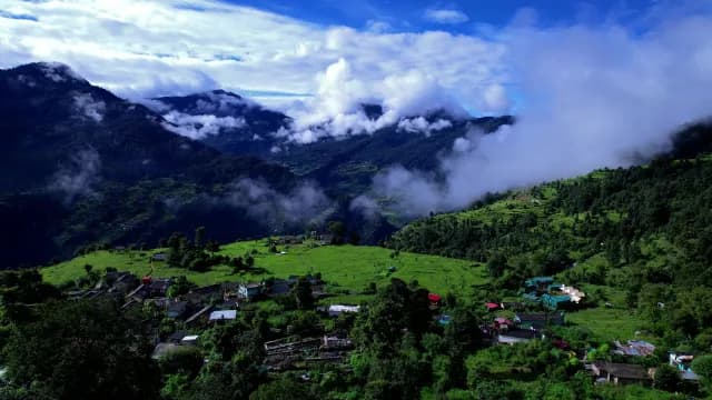 Scenic Himalayan Village with Misty Mountain Peaks and Lush Green Valleys Chopta, Uttarakhand