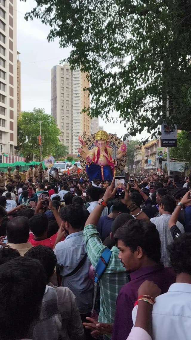 Vibrant Ganesh Chaturthi Festival Procession with Crowds in Mumbai