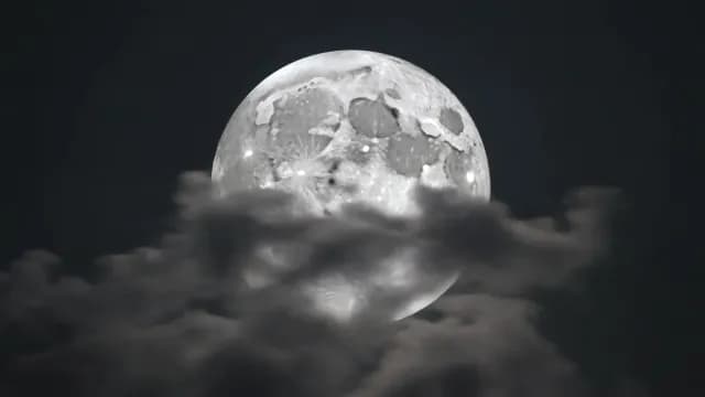 Detailed Full Moon Shining Through Dark Night Clouds