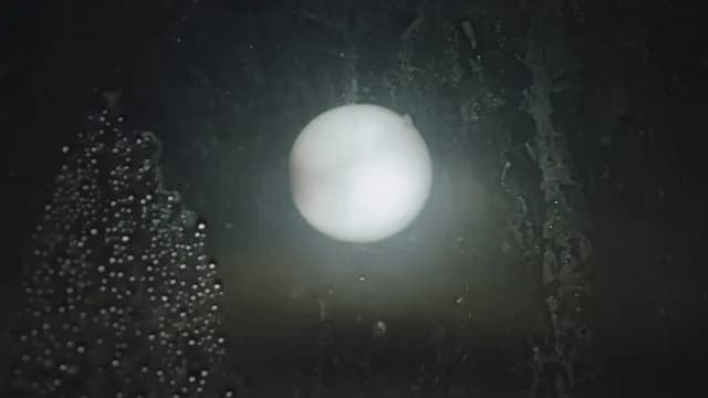 Moon Light Through Condensation Covered Window