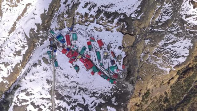 Aerial Birds Eye View of Remote Mountain Village in Snowy Terrain Chopta, Uttarakhand