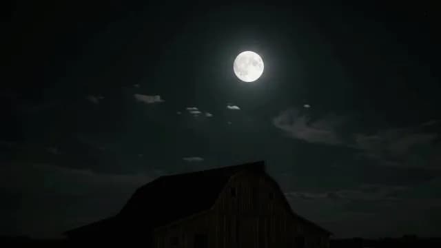 Bright Full Moon Glows Over Dark Silhouette of a Rural Barn