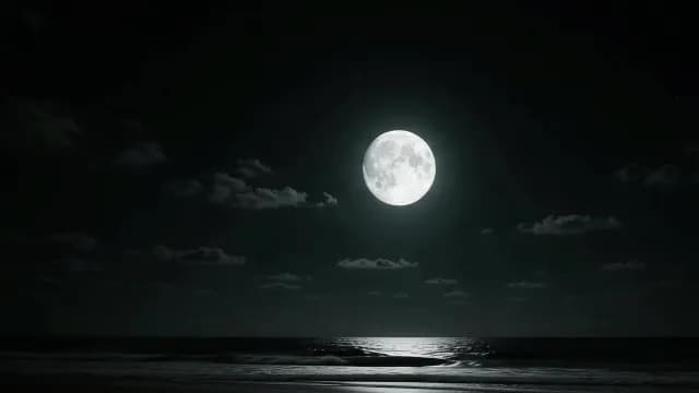 Bright Full Moon Illuminating the Ocean Waves at Night