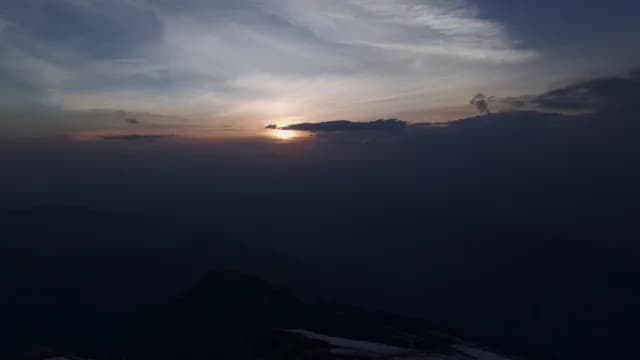 Breathtaking Sunset Over Silhouetted Chandrashila Peak and Himalayan Mountains in Chopta, Uttarakhand Peaks at Dusk