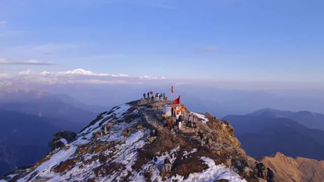 Hikers and Pilgrims at Chandrashila Peak Summit in the Chandrashila Peak and Himalayan Mountains in Chopta, Uttarakhand