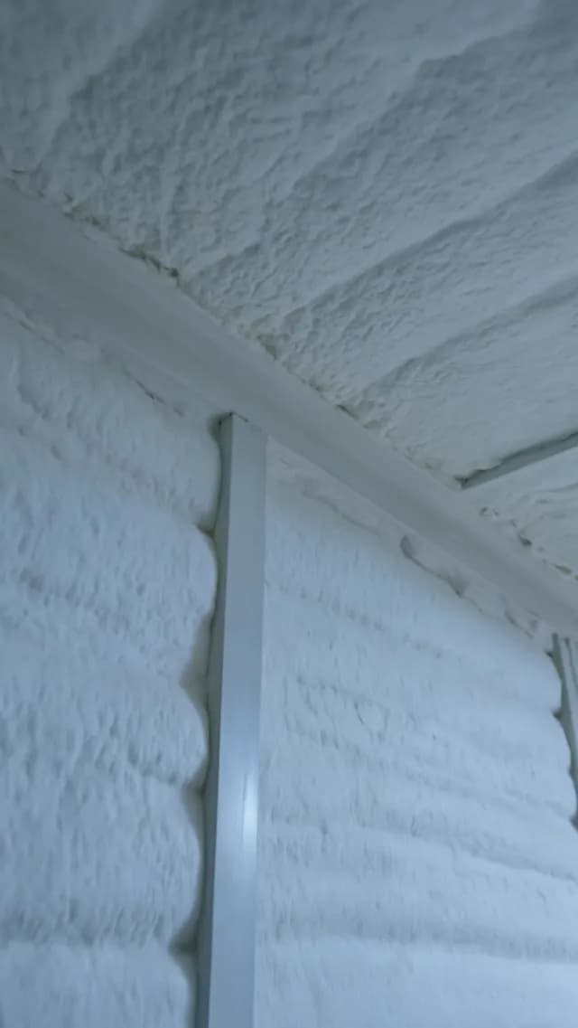 White Spray Foam Insulation Applied to Walls and Ceiling of Building
