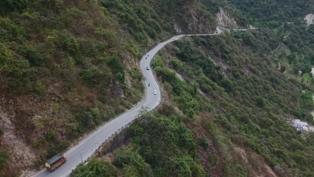 Aerial View of Winding Mountain of Alaknanda River, Rudraprayag Road, Uttarakhand with Traffic in Lush Hills