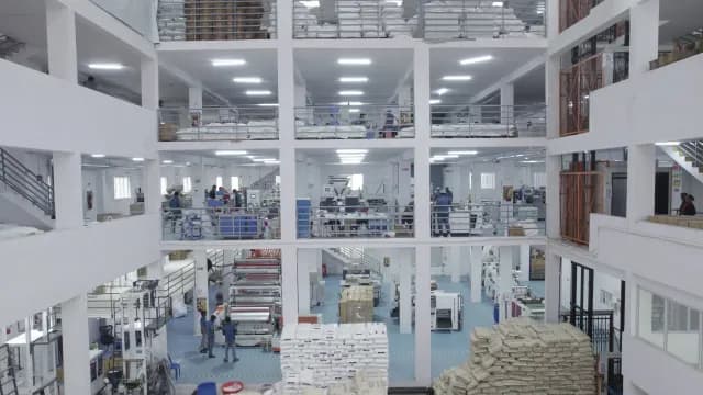 Modern Multi-Level Industrial Manufacturing Facility with Active Production Lines