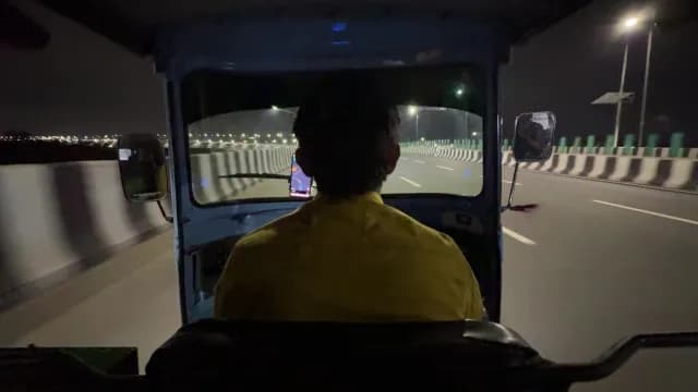 POV View of Auto Rickshaw Driving on Highway at Night