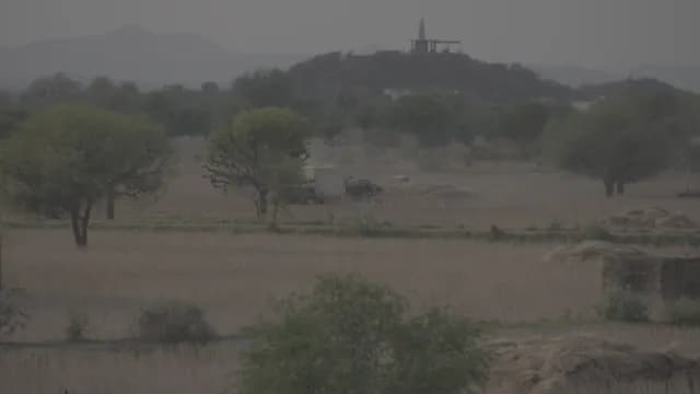 Rural Indian Landscape with Temple on Hill During Harvest Season, Rajasthan
