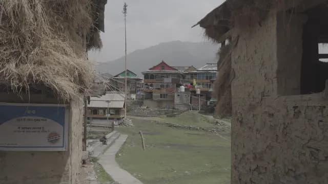 Traditional Himalayan Sarchi Village of Tirthan Valley with Mud Houses and Mountain Backdrop