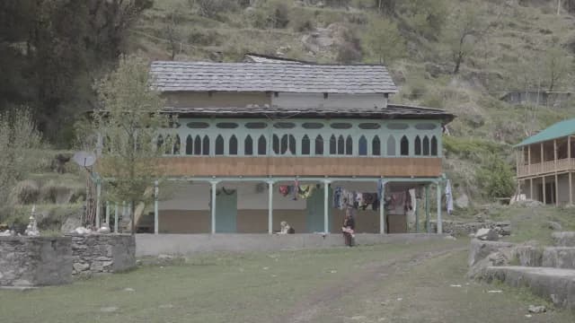 Traditional Himalayan Sarchi Village,  House with Rustic Architecture and Mountain Backdrop