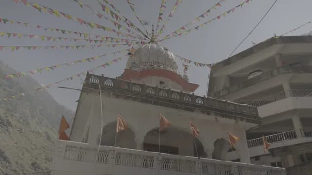 Gurudwara Manikaran Sahib with Colorful Prayer Flags in Himachal Pradesh Mountains