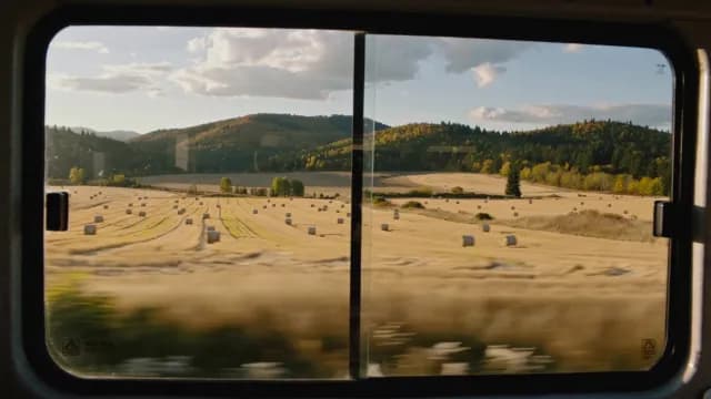 Scenic View of Autumn Harvest Fields Through a Moving Vehicle Window