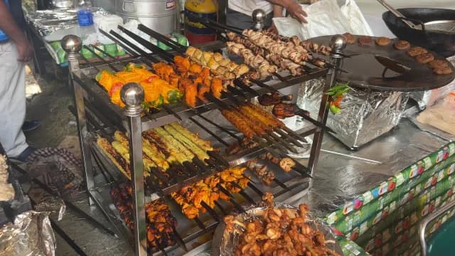 Variety of Traditional Indian Kebabs and Tikkas at Outdoor Food Market